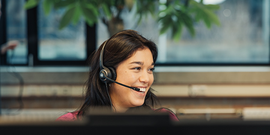 Girl_with_Headset_Behind_Monitor